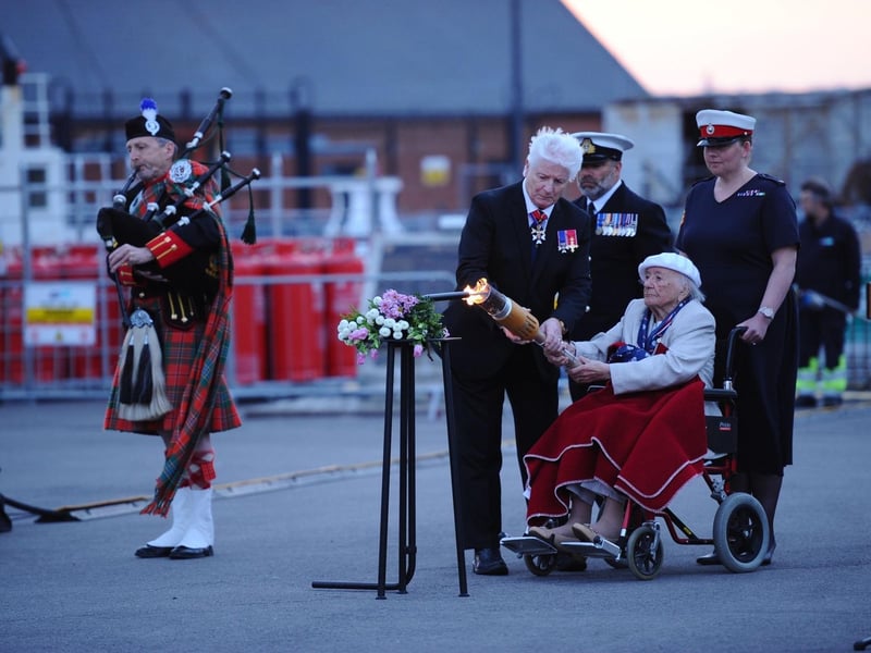 The beacons being lit by 99-year-old veteran Vera Brett