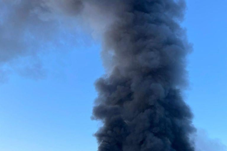 More than 80 firefighters were deployed to tackle a ferocious garage fire, which spread to nearby vehicles and buildings. Smoke could be seen filling the sky.