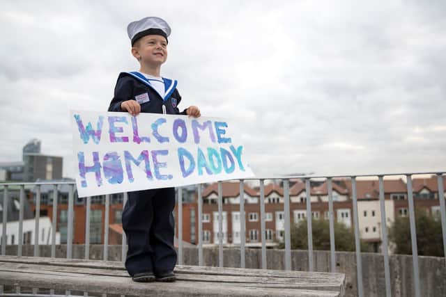 Four year old Ethan poses for a picture on the Round Tower in Portsmouth as he waits for the return of his father Able Seaman Shaun Lamb onboard HMS Ledbury. Picture: Andrew Matthews/PA Wire