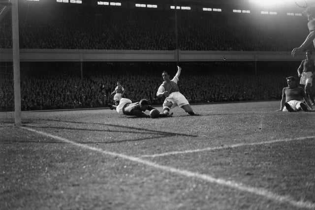 17th September 1955:  Arsenal striker Tommy Lawton competes for the ball with Portsmouth goal keeper, Uprichard, at Highbury.  (Photo by Reg Birkett/Keystone/Getty Images)