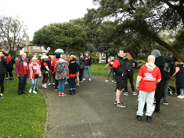 Charity walkers wait for the Portsmouth twilight walk for brain cancer to begin at Canoe Lake, Southsea on Saturday the 22nd of March 2025