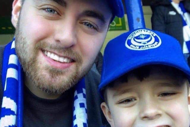 Avid Pompey supporters Simon and his son Arlo.