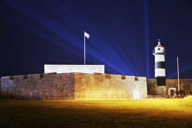 The laser show at Spitbank Fort from behind Southsea Castle.