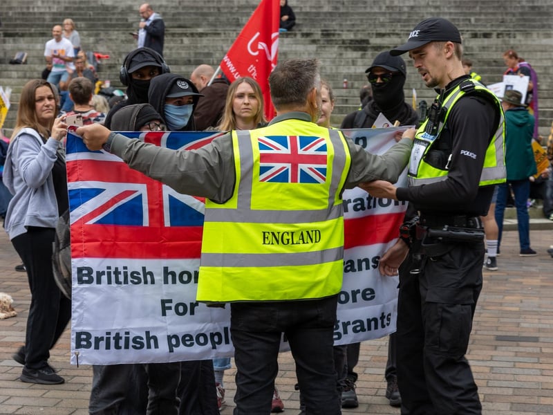 Police try to subdue any tension between the two groups.