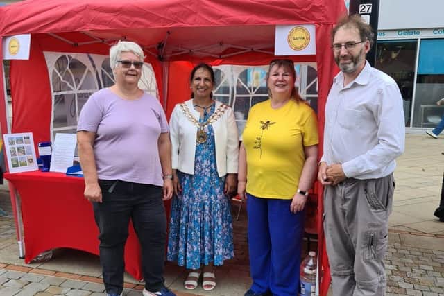 Photo of volunteers Janice, Louise, and David, with Mayor Pal Hayre.
