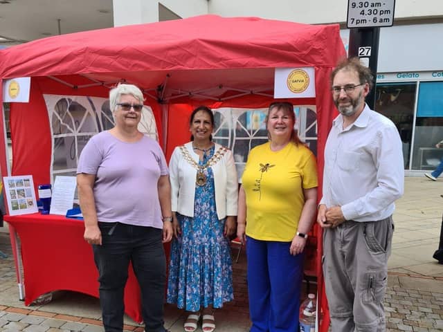 Photo of volunteers Janice, Louise, and David, with Mayor Pal Hayre.