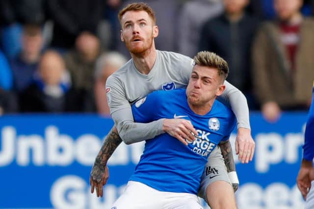 Pompey skipper Tom Naylor battles with Sammie Szmodics while he was loan at Peterborough last season. Picture: Simon Davies