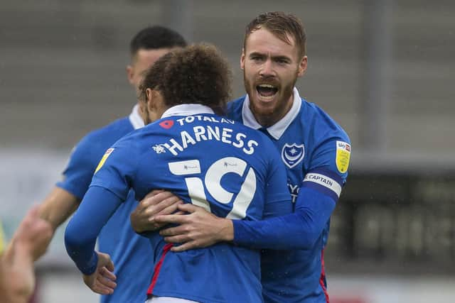 Tom Naylor congratulates team-mate Marcus Harness at Burton last Saturday.  Picture: Daniel Chesterton/phcimages.com