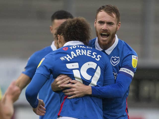 Tom Naylor congratulates team-mate Marcus Harness at Burton last Saturday.  Picture: Daniel Chesterton/phcimages.com