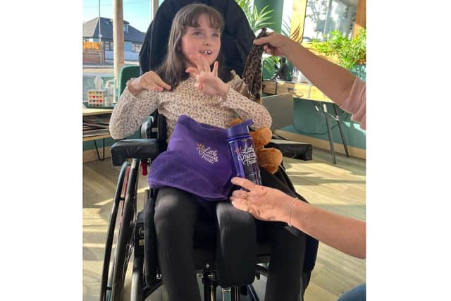 Lana Brown, 9, after her hair cut for the Little Princess Trust which raised £1,000 in sponsorship for her surgery
