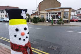 A woollen snowman keeps a bollard warm on Tangier Road