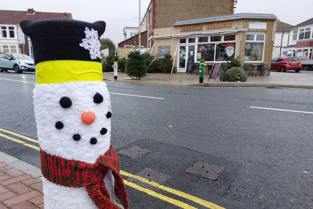 A woollen snowman keeps a bollard warm on Tangier Road