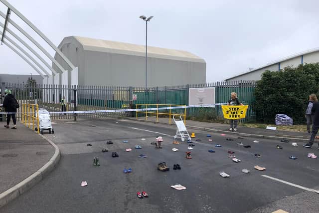 Extinction Rebellion Southsea are at the Veolia incinerator in Portsmouth today protesting about air pollution. They have placed children's shoes and pushchairs painted white to block the entrance. Picture: Richard Lemmer