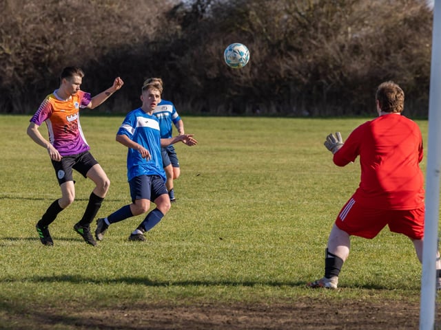 Bulldog (blue) v King George Rovers. Picture: Mike Cooter