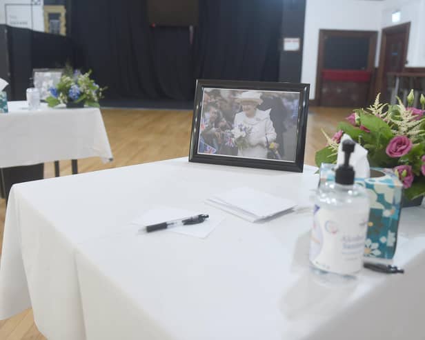 Thousands have signed a petition for the Queen to be honoured in an annual bank holiday. Pictured is the book of condolences at Portsmouth Guildhall. Picture: Sarah Standing (120922-3192).