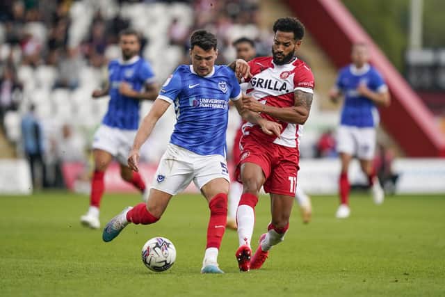 Centre-back Regan Poole brings the ball forward for Pompey during their goalless draw with Stevenage