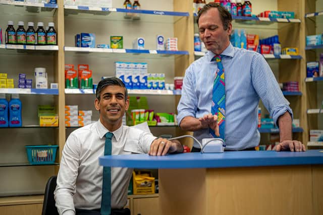 Prime Minister Rishi Sunak has his blood pressure checked by pharmacist Peter Baillie during a visit to a GP surgery and pharmacy in Weston today. Picture: Ben Birchall - WPA Pool/Getty Images.
