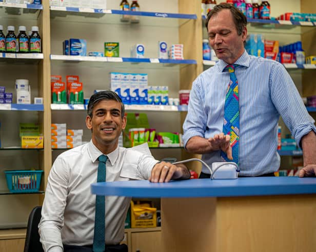 Prime Minister Rishi Sunak has his blood pressure checked by pharmacist Peter Baillie during a visit to a GP surgery and pharmacy in Weston today. Picture: Ben Birchall - WPA Pool/Getty Images.