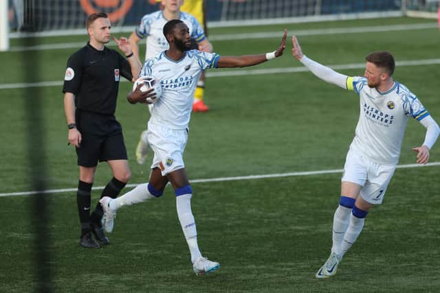 Mo Faal celebrates with Jake McCarthy after his late penalty leveller. Picture by Dave Haines