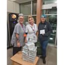 Jazz Oruamen (far left) and Kelly Marsh at St James Hospital receive the generous donation from Hayley Bucknall of The Crispy Cod fish and chips shop in Locksway Road, Southsea