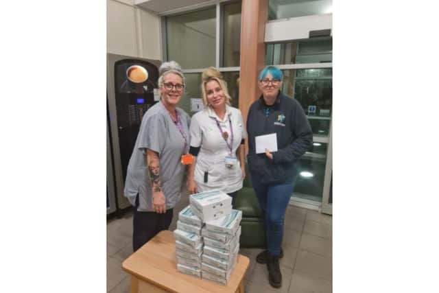 Jazz Oruamen (far left) and Kelly Marsh at St James Hospital receive the generous donation from Hayley Bucknall of The Crispy Cod fish and chips shop in Locksway Road, Southsea