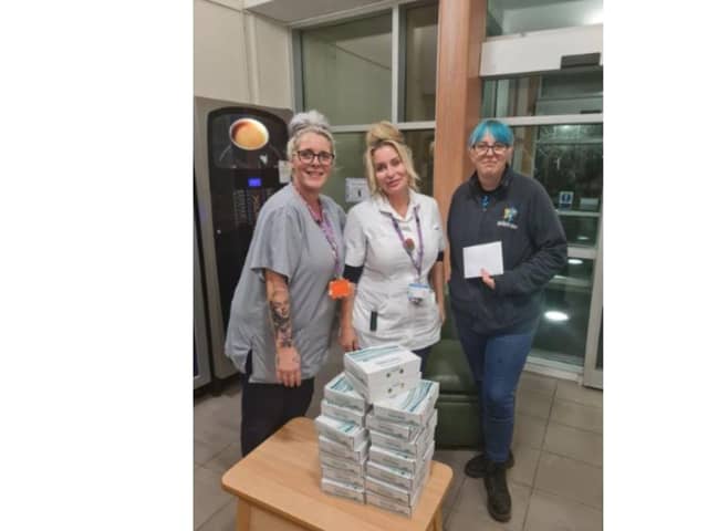 Jazz Oruamen (far left) and Kelly Marsh at St James Hospital receive the generous donation from Hayley Bucknall of The Crispy Cod fish and chips shop in Locksway Road, Southsea