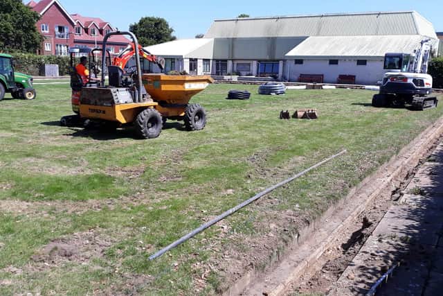 Work starts on ripping up the grass surface at Hayling Island Bowls Club in the summer