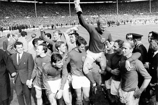 Alan Ball (fourth from left) celebrates with fellow members of England's 1966 World Cup-winning side. Picture: Empics