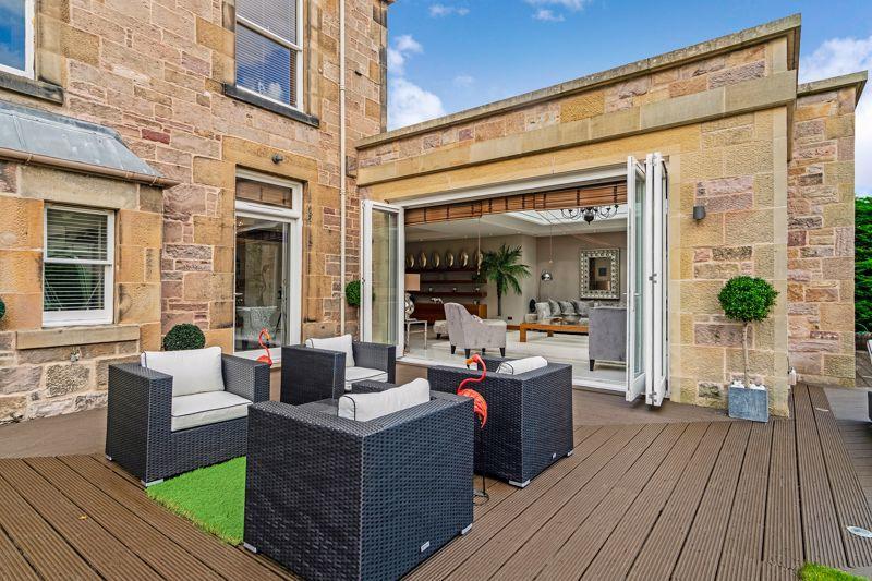 The large timber decking area in the rear garden can be accessed via the lounge by glass folding doors.