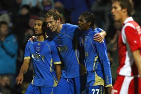 Peter Crouch, centre, with former Pompey team-mates Armand Traoré and Kanu