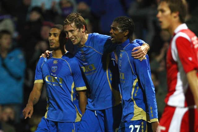 Peter Crouch, centre, with former Pompey team-mates Armand Traoré and Kanu