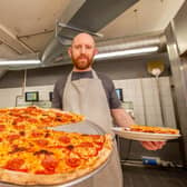 George Goodrham at Giorgio's Pizza, Waterlooville, with its 20" spicy salsiccia pizza. Picture: Habibur Rahman