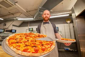 George Goodrham at Giorgio's Pizza, Waterlooville, with its 20" spicy salsiccia pizza. Picture: Habibur Rahman