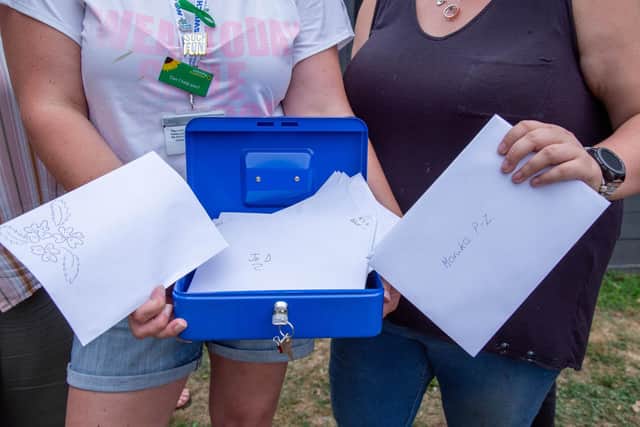 Contents of the time capsule that has messages written in postcards. Picture: Habibur Rahman