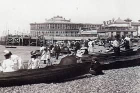 Dressed for summer. Row boats for hire and gentlemen taking their girls dressed in white for a row alongside Clarence Pier