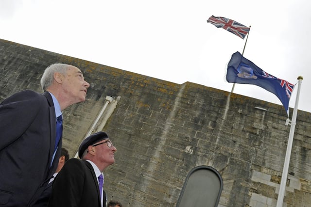 A flag has been raised at The Falklands Memorial in Old Portsmouth to mark the 37th anniversary of the end of the conflict.
Dave Colville who was working in the Falklands during the war with veteran Chris Purcell who was aboard HMS Sheffield.
Picture: Ian Hargreaves  (140619-6)