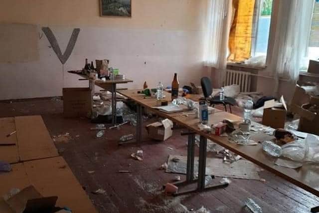 Shattered glass and empty bottles were strewn across the floor, as Russian soldiers lived in the Borodyanka school. Picture: Jo Cullimore/PA Wire.