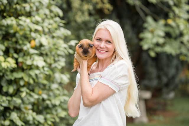 Amanda Beamish and her guinea pig, Sadie. 
Picture credit: Piggie Parcels