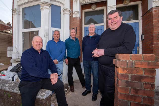 Portsmouth Community Housing Trust has finally got the go-ahead to refurbish two disused properties and bring them back into use for homeless families. Pictured, left to right, are Keith Johnson and Neil Scutt - directors of JPC Property Services, which is carrying out the work - trust secretary Andrew Mason, trust board member
Mark Singleton and trust chairman Father Bob White. Picture: Habibur Rahman