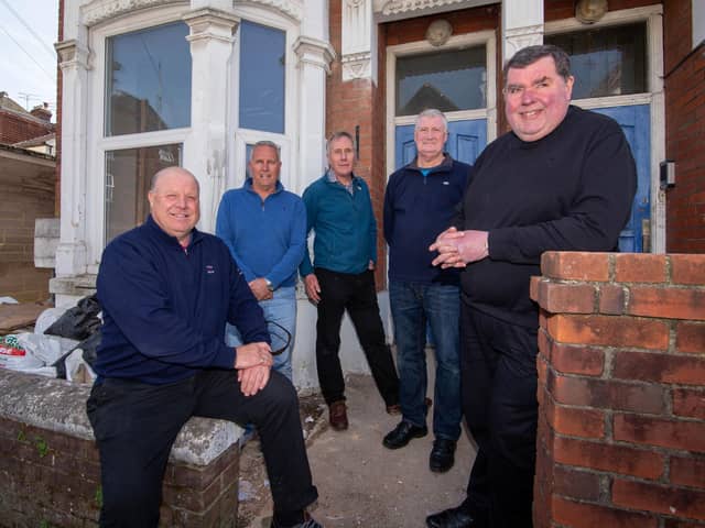 Portsmouth Community Housing Trust has finally got the go-ahead to refurbish two disused properties and bring them back into use for homeless families. Pictured, left to right, are Keith Johnson and Neil Scutt - directors of JPC Property Services, which is carrying out the work - trust secretary Andrew Mason, trust board member
Mark Singleton and trust chairman Father Bob White. Picture: Habibur Rahman