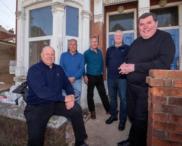 Portsmouth Community Housing Trust has finally got the go-ahead to refurbish two disused properties and bring them back into use for homeless families. Pictured, left to right, are Keith Johnson and Neil Scutt - directors of JPC Property Services, which is carrying out the work - trust secretary Andrew Mason, trust board member
Mark Singleton and trust chairman Father Bob White. Picture: Habibur Rahman