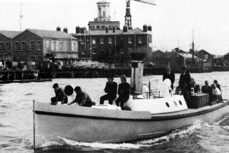 Pinnace 199 in harbour 1980
Underway in Portsmouth Harbour with the late Rear Admiral 'Johnnie' Warsop, who was Flag Officer Portsmouth, at the helm. As a naval engineer he was an enthusiastic supporter of the vessel.