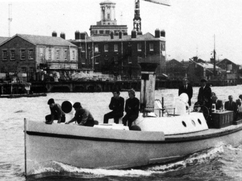 Pinnace 199 in harbour 1980
Underway in Portsmouth Harbour with the late Rear Admiral 'Johnnie' Warsop, who was Flag Officer Portsmouth, at the helm. As a naval engineer he was an enthusiastic supporter of the vessel.