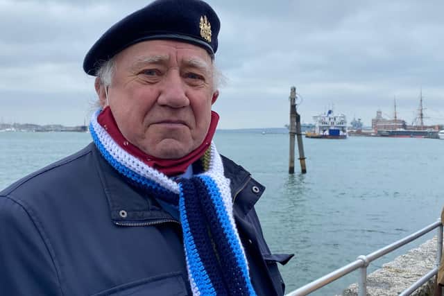 Falklands veteran David Watts, 80, of Southsea, met Prince Philip. Here he is pictured outside The Spice Island Inn during the 41-gun salute with HMS Prince of Wales in the background. Photo: Tom Cotterill
