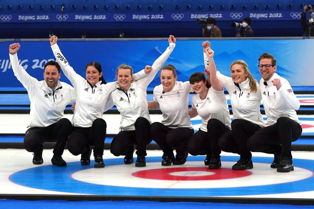 Coach David Murdoch, Eve Muirhead, Vicky Wright, Jenn Dodds, Hailey Duff, reserve Mili Smith and coach Kristian Lindstrom celebrate on the ice