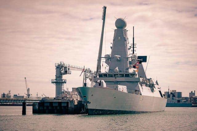 Type 45 destroyer HMS Diamond pictured alongside at the Upper Harbour Ammunition Facility in Portsmouth, where warships are rearmed safely. Photo: Royal Navy