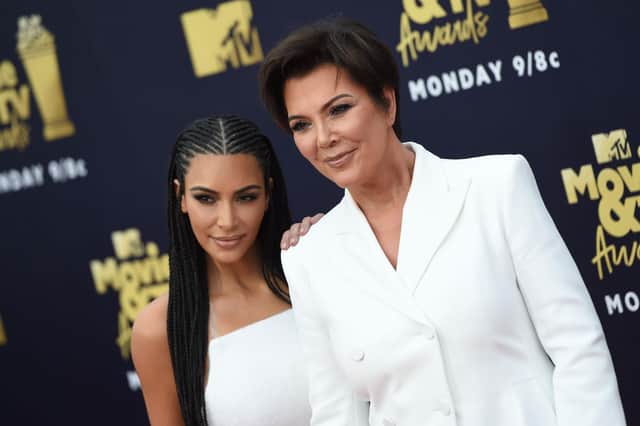 In this file photo taken on June 16, 2018 US TV personality Kim Kardashian (L) and her mother Kris Jenner attend the 2018 MTV Movie & TV awards, at the Barker Hangar in Santa Monica. (Photo by VALERIE MACON/AFP via Getty Images)