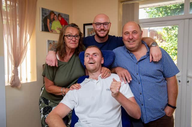 Jack Farrugia continues to battle after suffering severe brain damage in a car accident in 2008. Pictured with mother Lorraine, brother Joe and father Laurence. Picture: Habibur Rahman