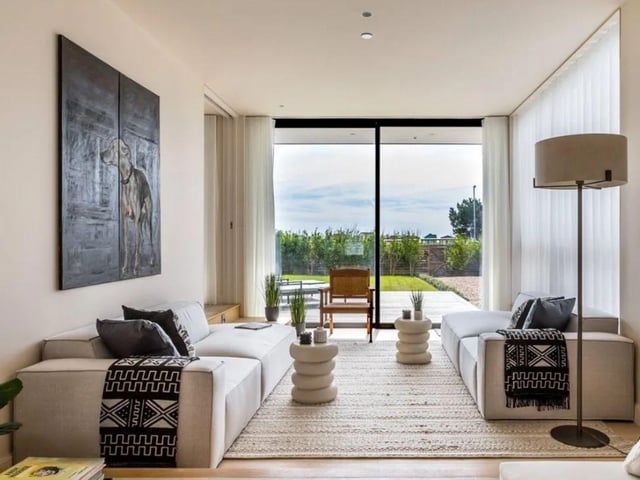 This property comes with four bedrooms, four bathrooms and three reception rooms.