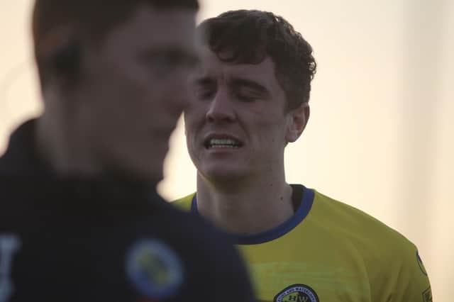 Substitute Paul Rooney's reaction to being forced off injured minutes after coming on at Oxford City sums up the downbeat feeling around the Hawks at present Picture: Kieron Louloudis